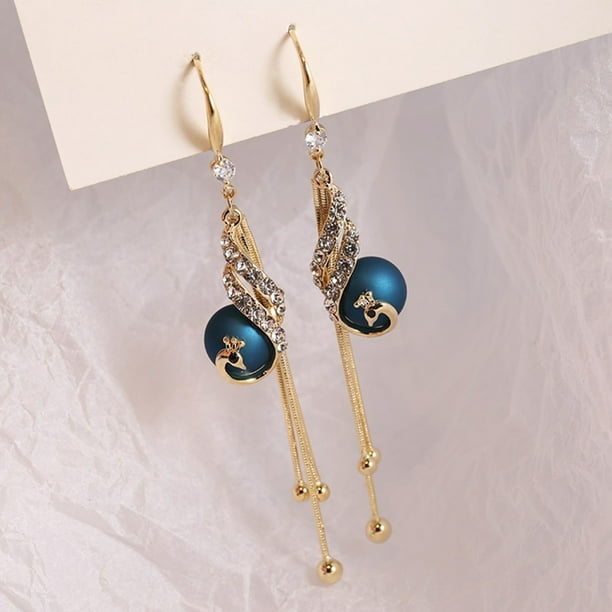 🔥 Aretes de pavo real — una joya exclusiva para mujeres con estilo. 💎 Elegancia, distinción y brillo en cada detalle. ✨ Diseño de lujo para quienes no aceptan lo común.
