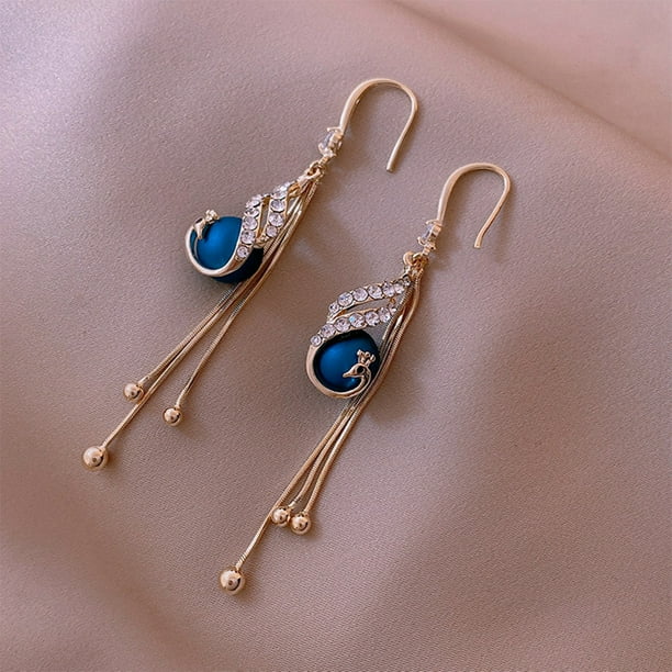 🔥 Aretes de pavo real — una joya exclusiva para mujeres con estilo. 💎 Elegancia, distinción y brillo en cada detalle. ✨ Diseño de lujo para quienes no aceptan lo común.